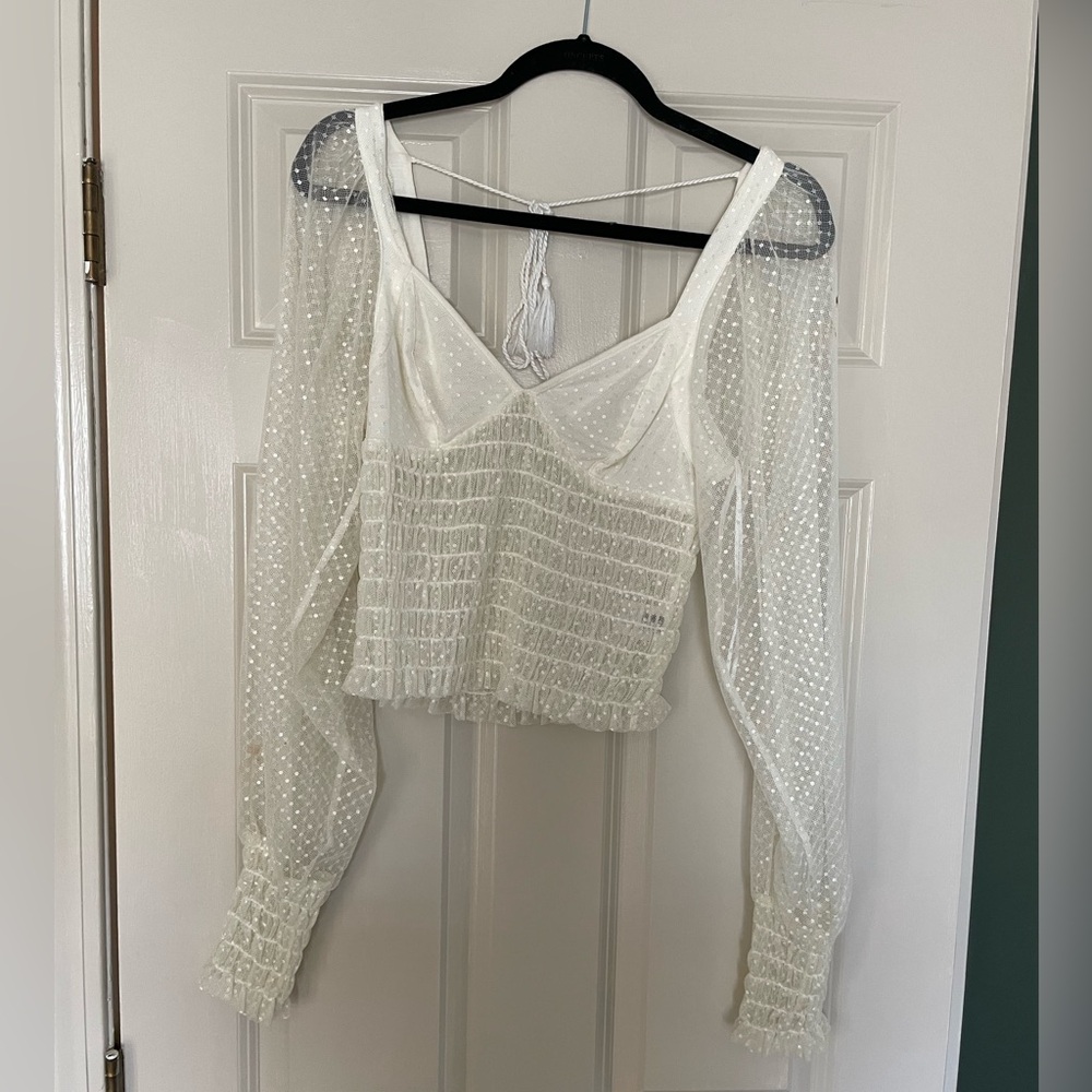 Beautiful white lace blouse with bell sleeves